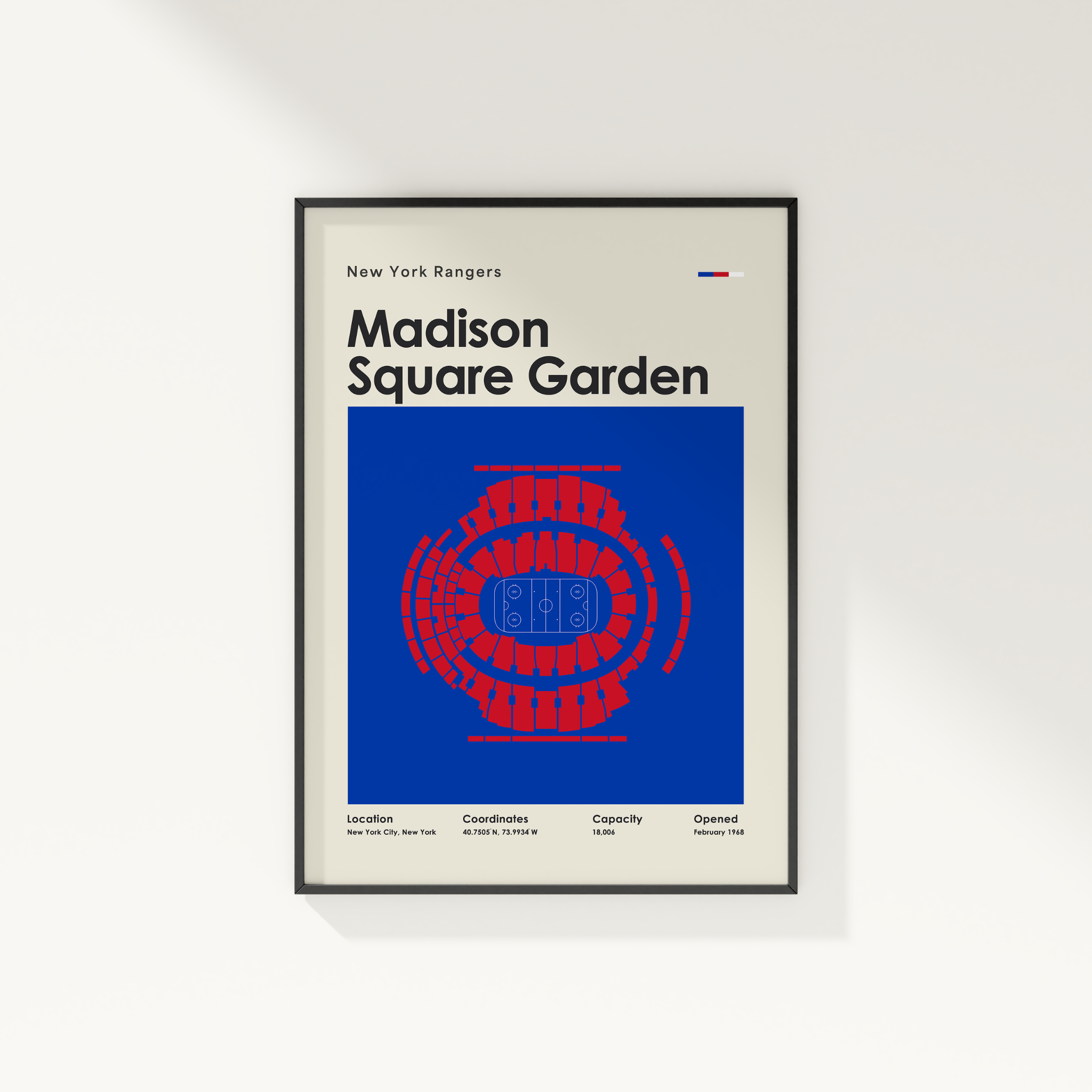 Framed poster of Madison Square Garden with New York Rangers branding on a white wall.
