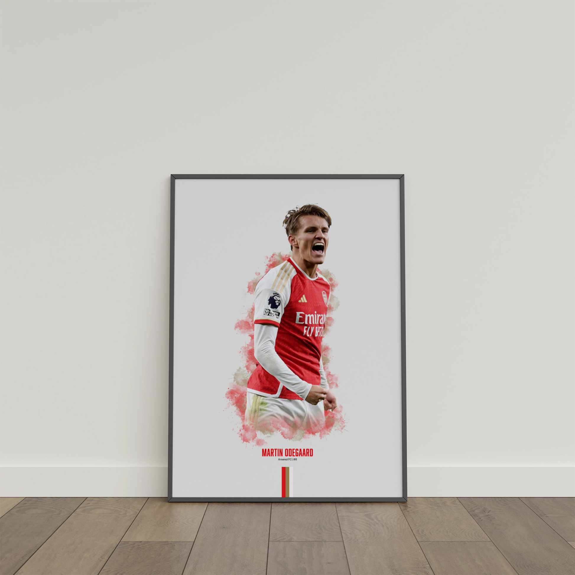 framed poster mockup of soccer player martin odegaard leaning on a white wall