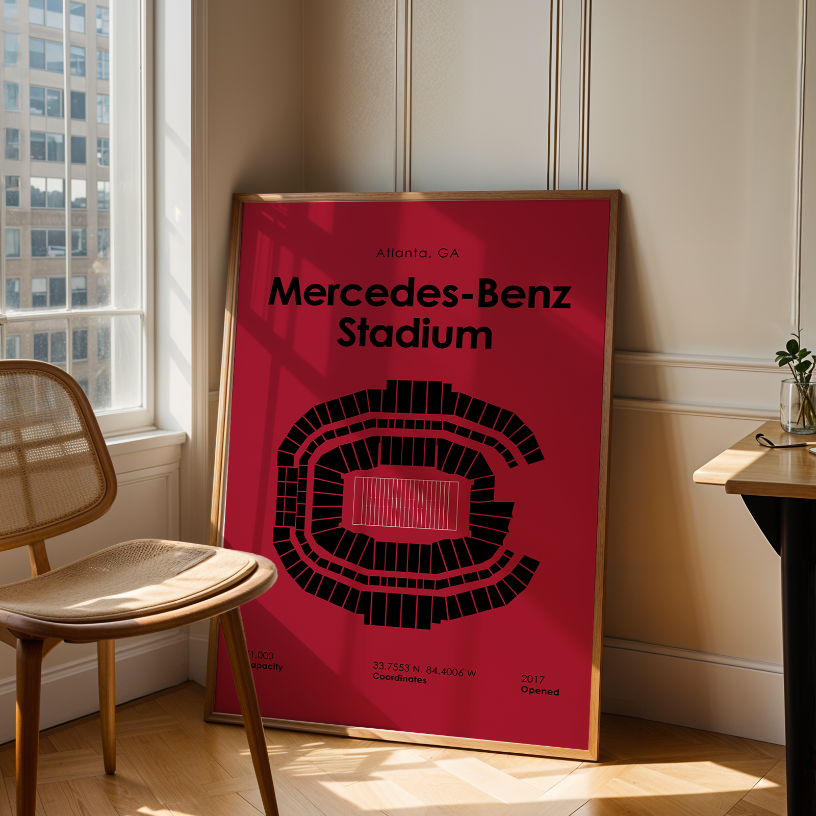 Poster of Mercedes-Benz Stadium in a room with a chair and table.
