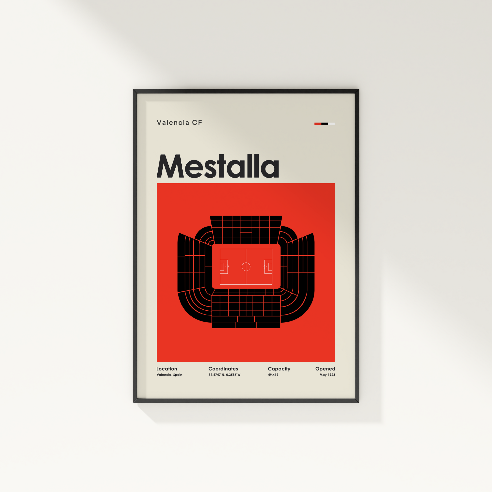 Framed poster of Valencia CF Mestalla stadium design on a white wall.