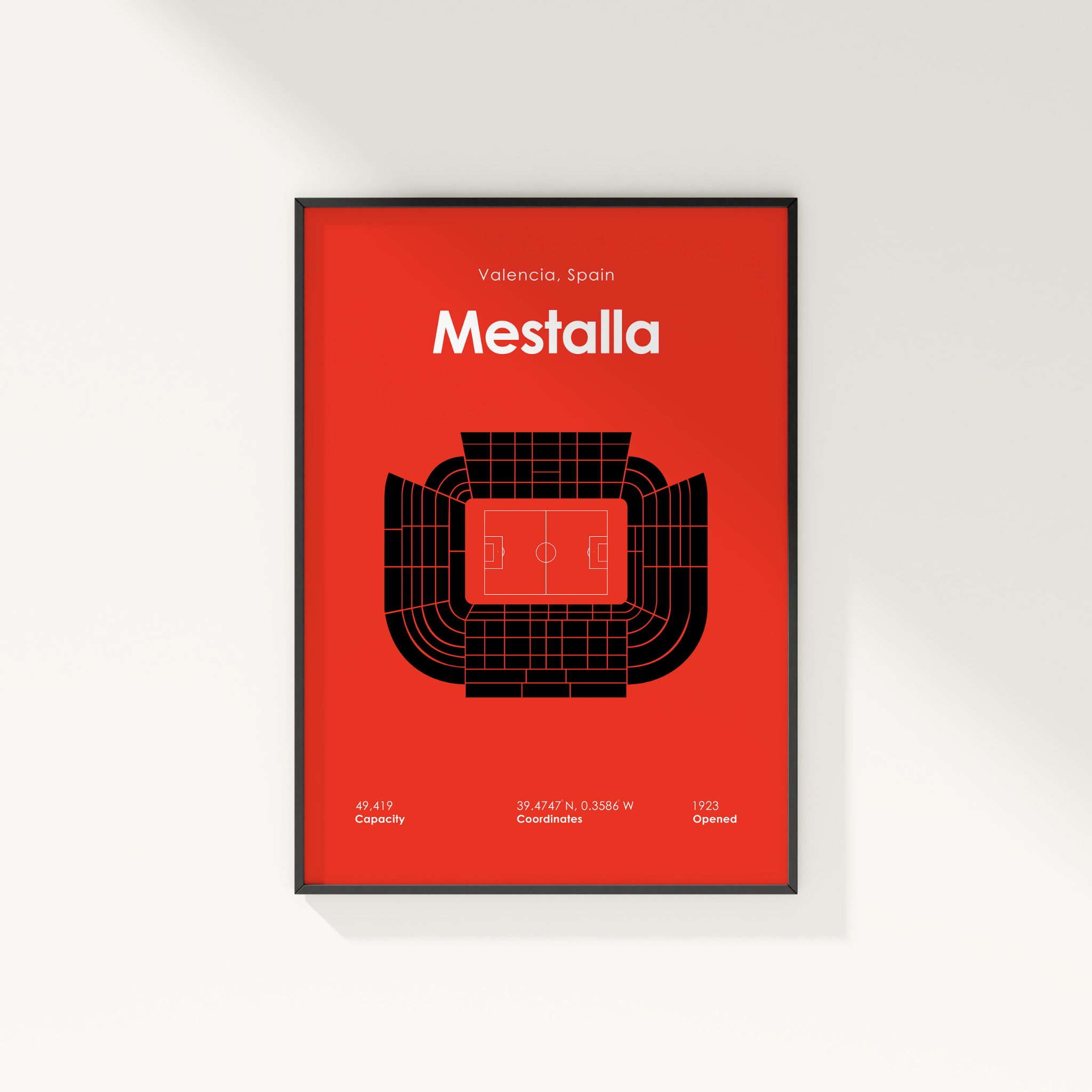 Framed poster of Mestalla stadium layout on a red background