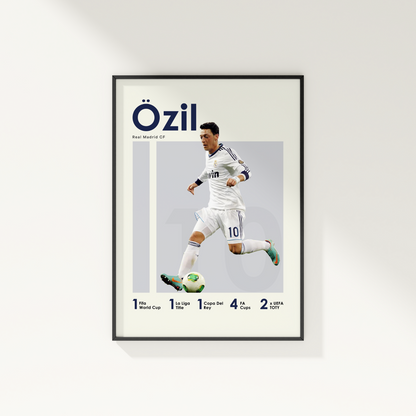 framed poster mockup of football player mesut ozil hanging on a white wall