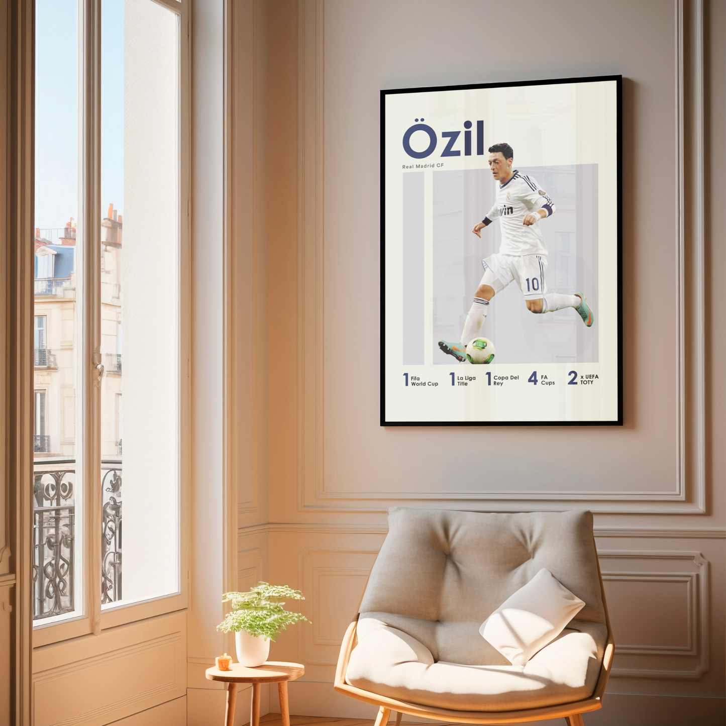 framed poster mockup of football player mesut ozil hanging in a living room