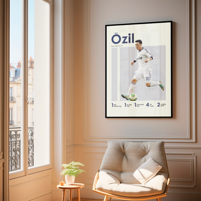 framed poster mockup of football player mesut ozil hanging in a living room