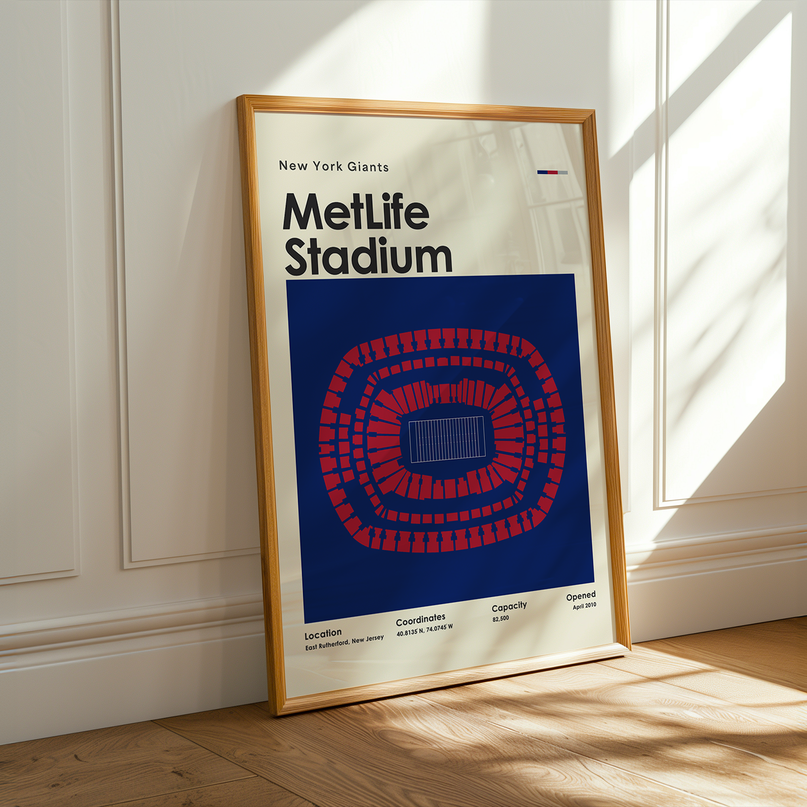 Framed poster of MetLife Stadium with New York Giants branding on a wall.