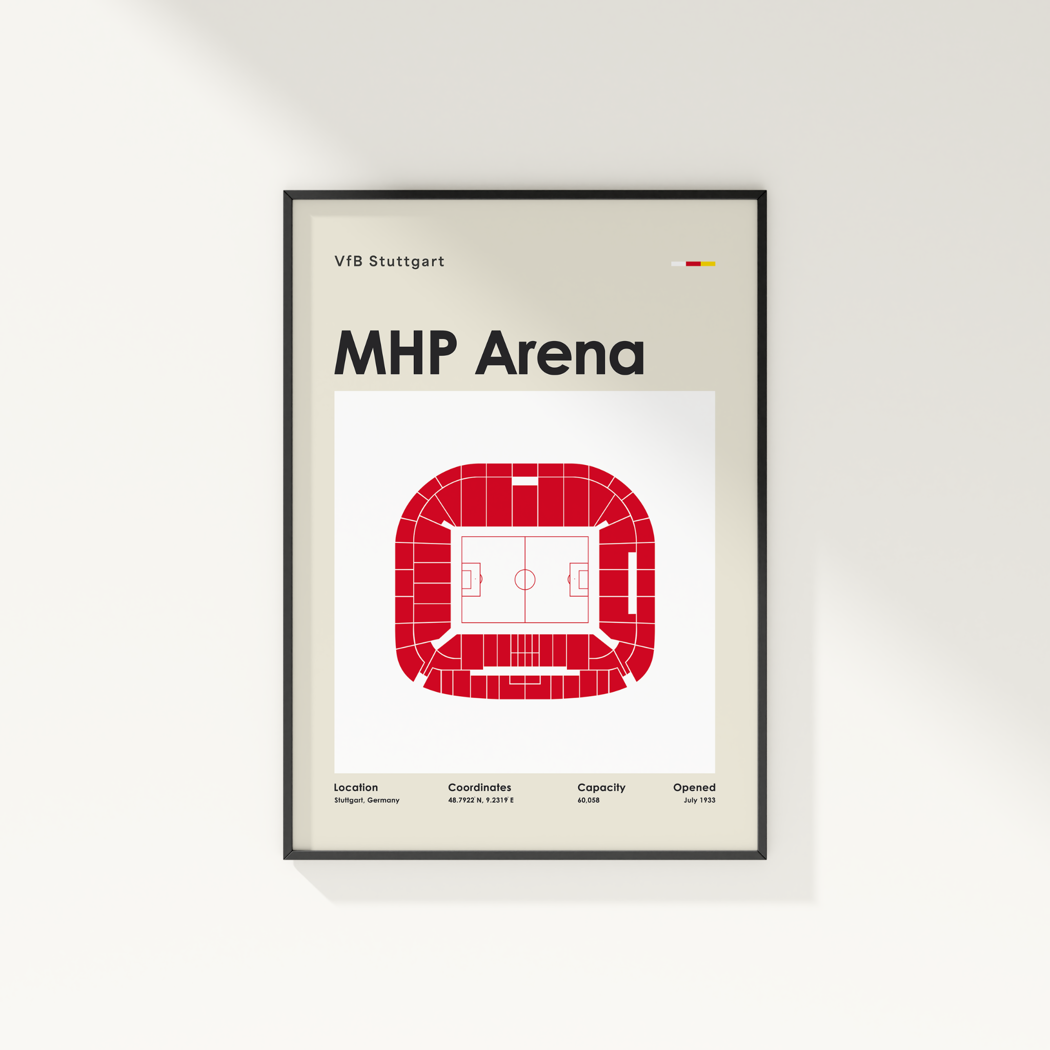 A framed minimalist poster of the MHP Arena in Stuttgart, Germany, featuring a red stadium floor plan on a light beige and white background, displayed on a clean white wall.