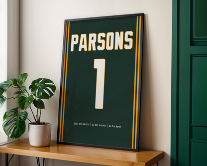 Framed sports jersey with 'Parsons' and number '1' on a wooden shelf.