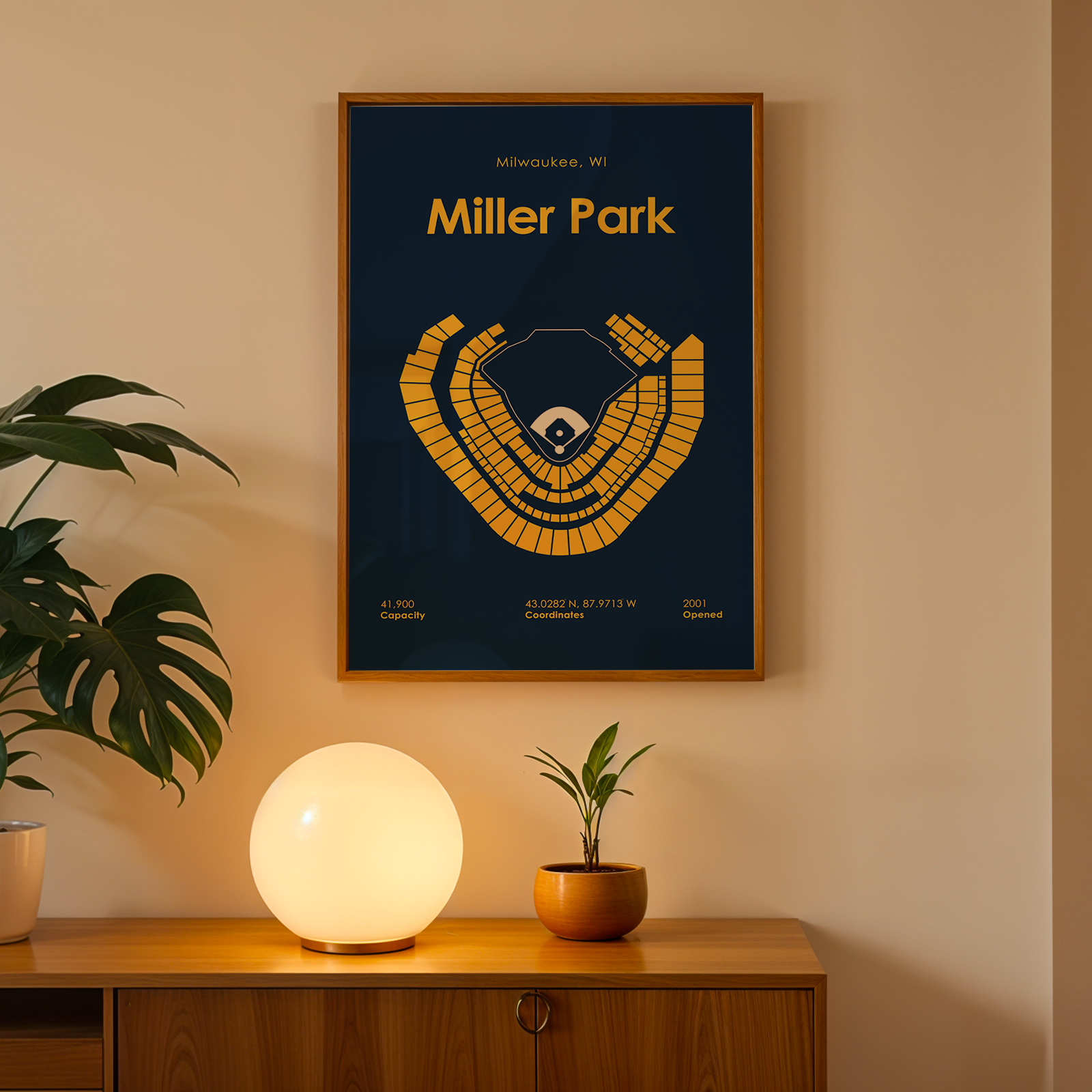 Framed 'Miller Park' poster on a wall above a wooden cabinet with decorative items.