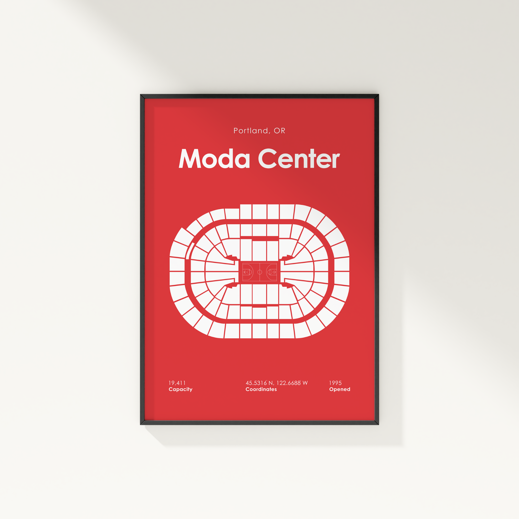 Framed poster of Moda Center layout on a red background