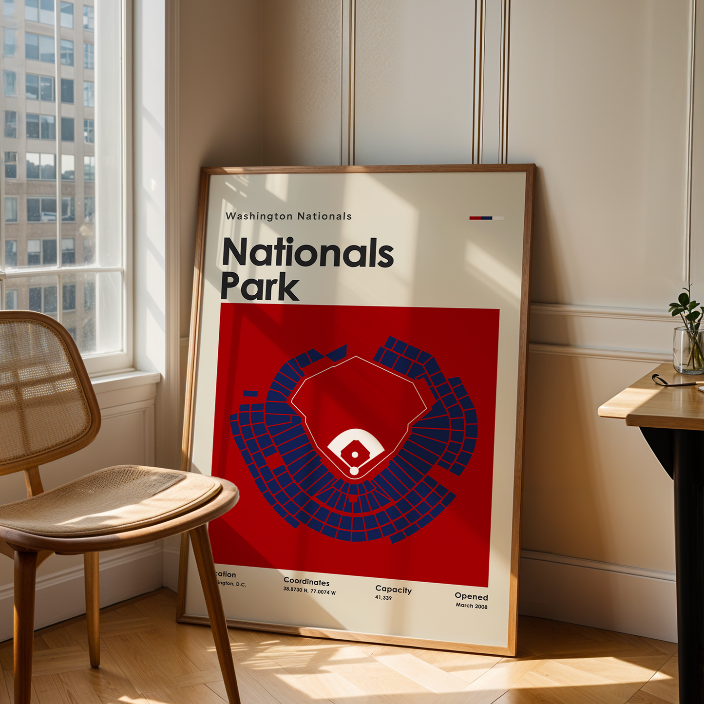 Poster of Nationals Park in a room with a chair and table.