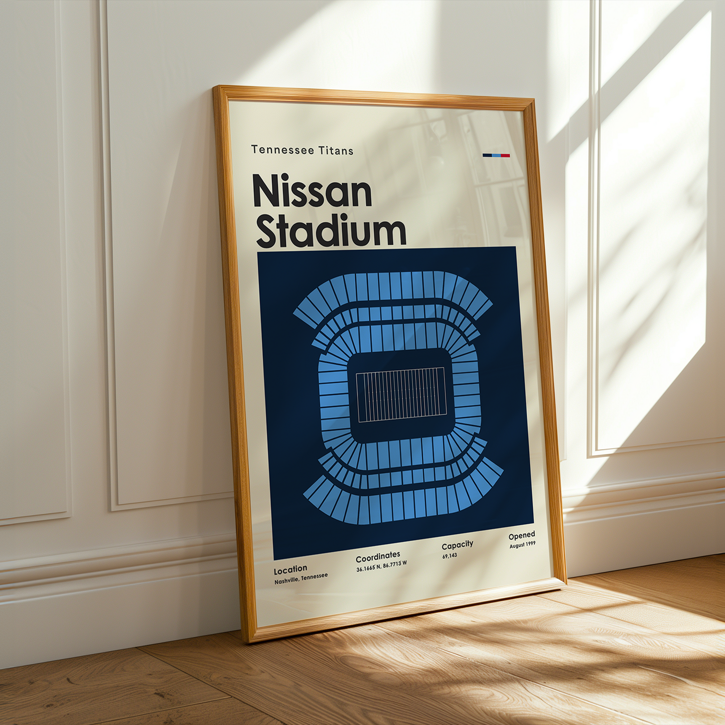 Framed poster of Nissan Stadium with Tennessee Titans branding on a wall.