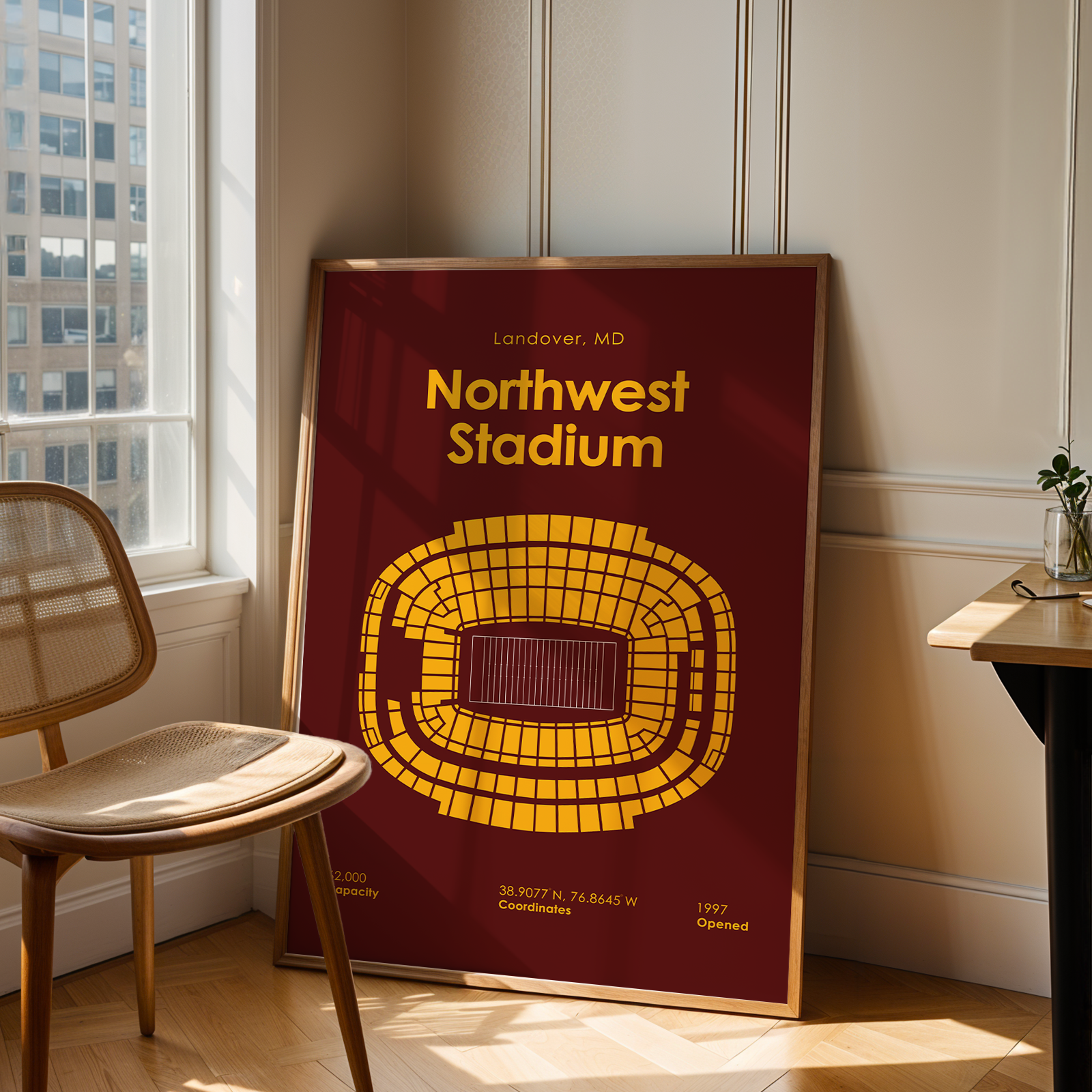 Poster of Northwest Stadium in a room with a chair and table.
