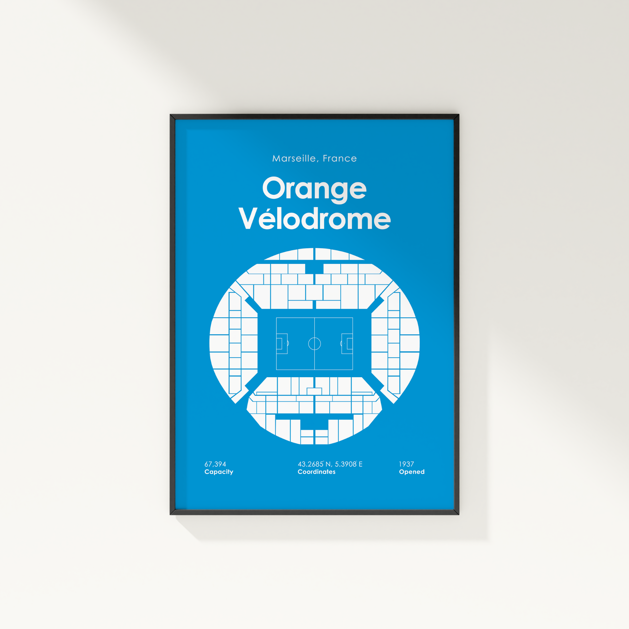 Framed poster of Orange Velodrome with blue background and white text