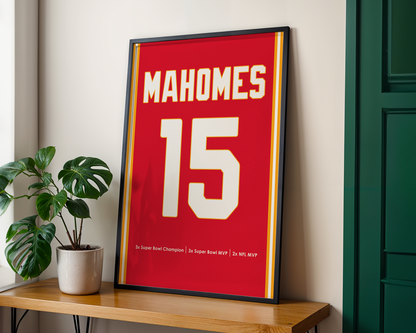 Framed sports jersey with 'Mahomes 15' on a wooden shelf.