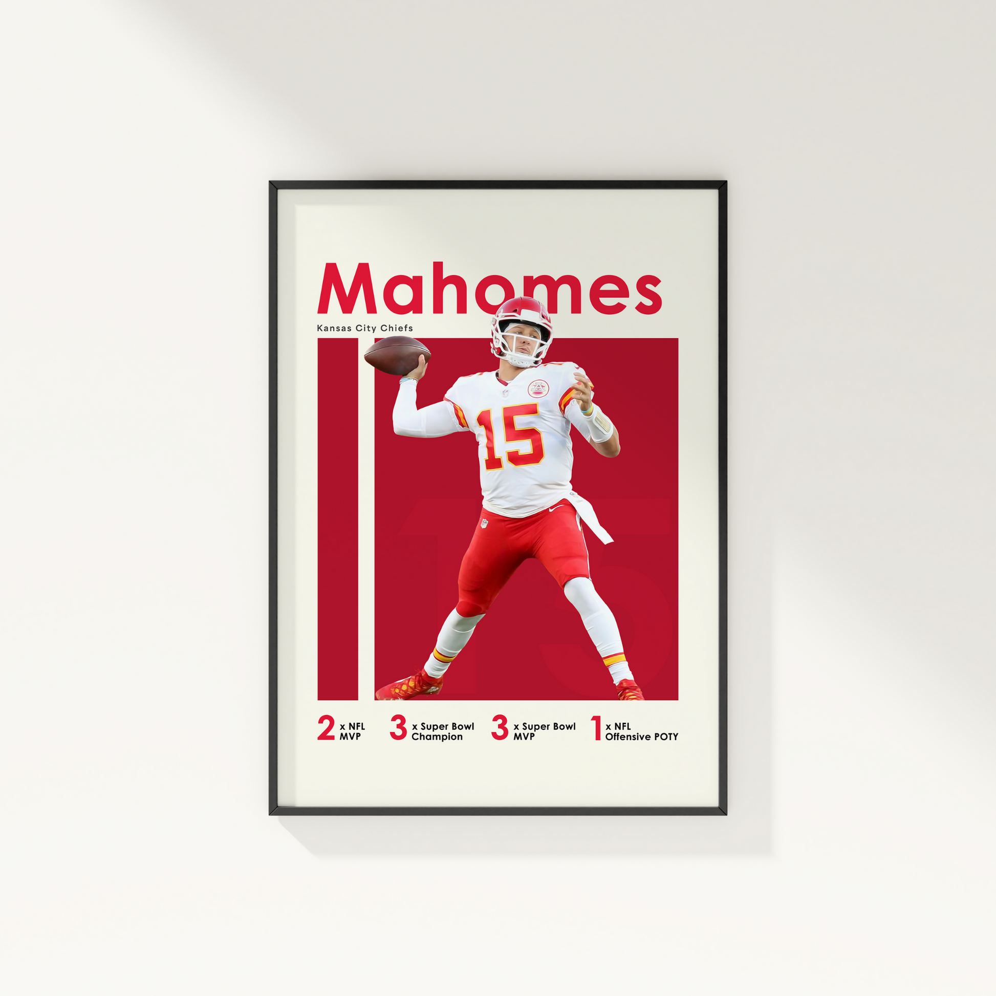 framed poster mockup of football player patrick mahomes hanging on a white wall