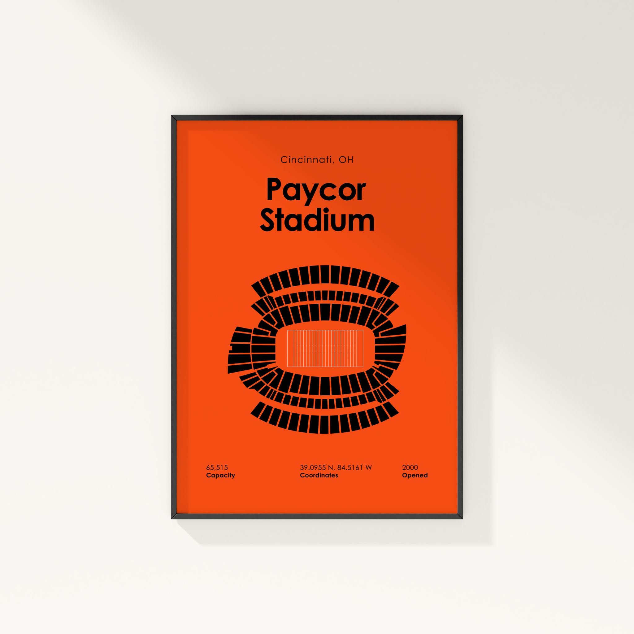 Framed poster of Paycor Stadium with orange background and black text