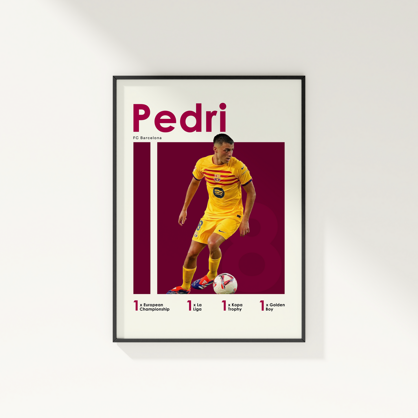 framed poster mockup of soccer player pedri hanging on a white wall