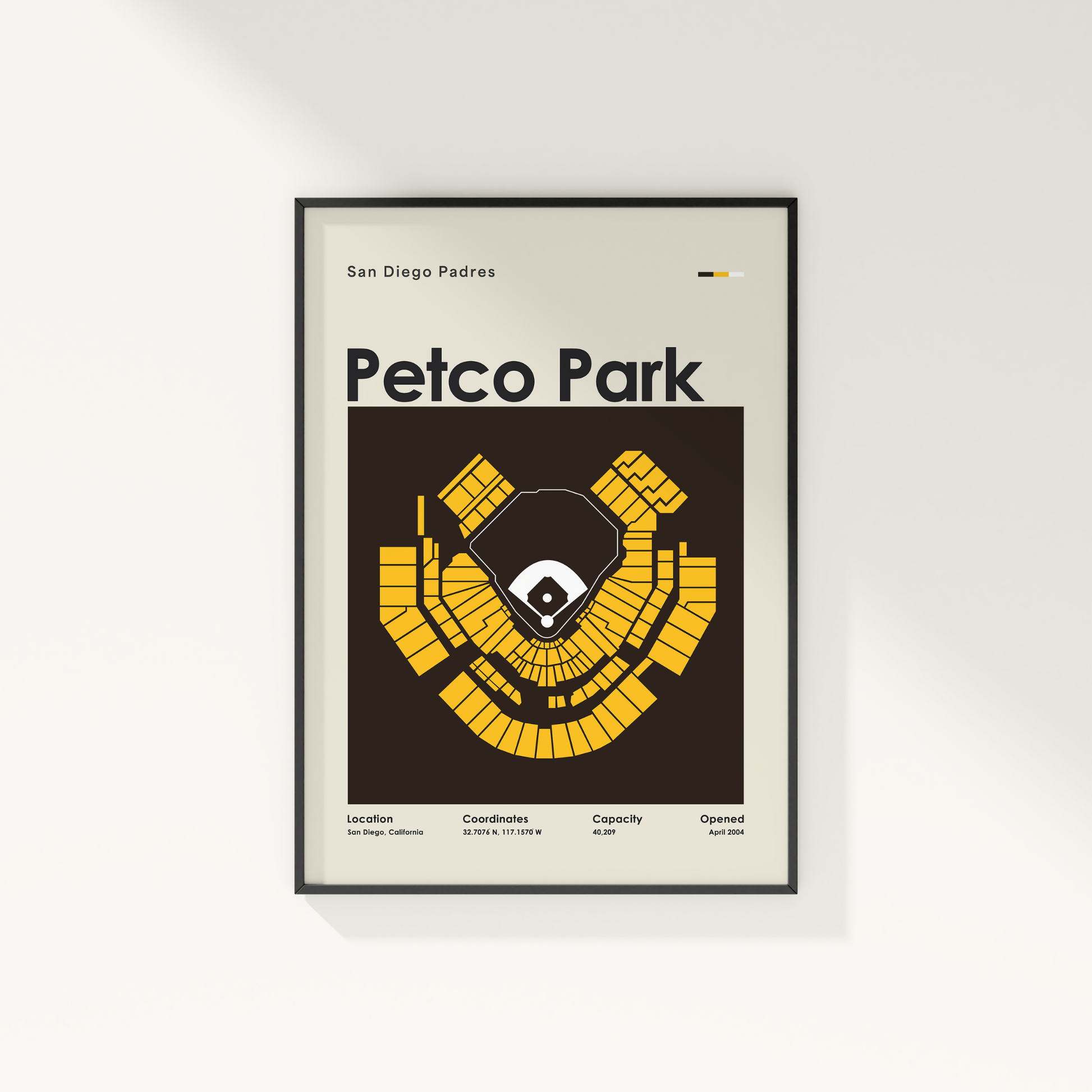 Framed poster of Petco Park layout for San Diego Padres on a white wall.