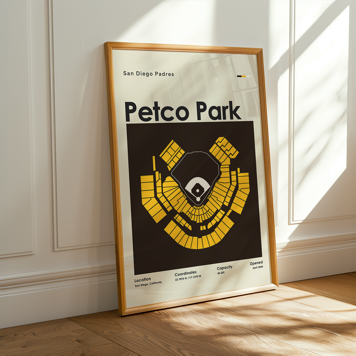 Framed poster of Petco Park with San Diego Padres logo on a wall.