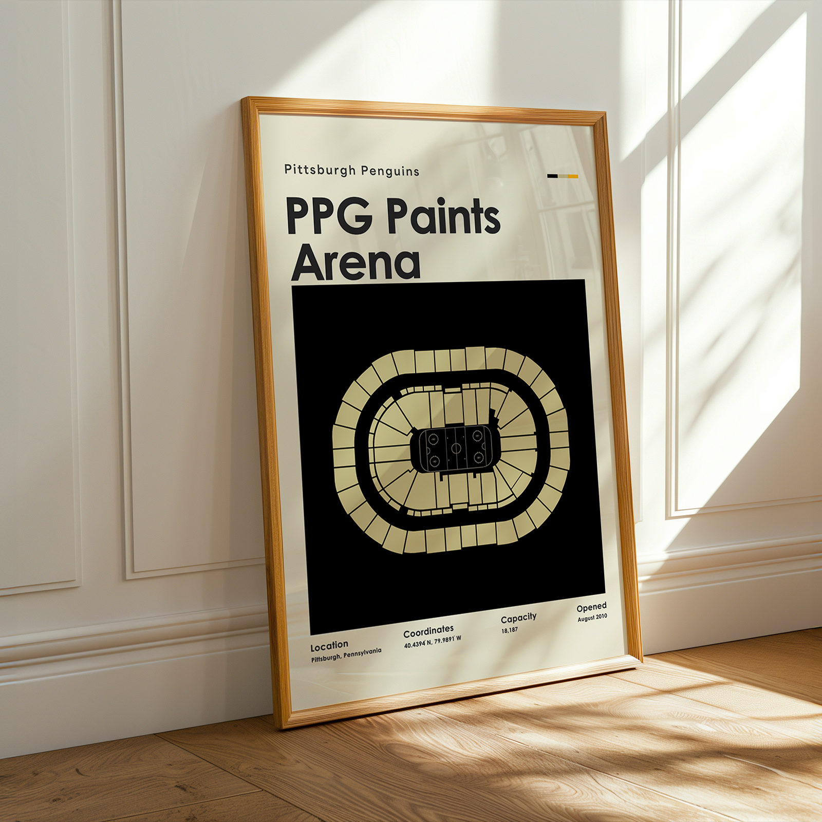 Framed poster of PPG Paints Arena with wooden frame on a white wall.