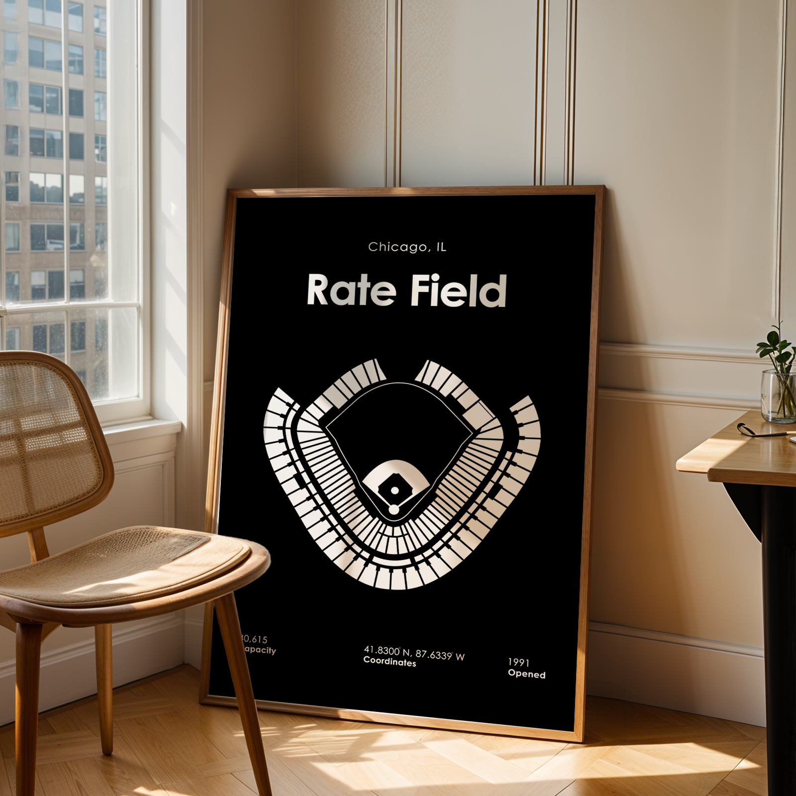 Framed poster of a baseball field layout in Chicago, IL, leaning against a wall.