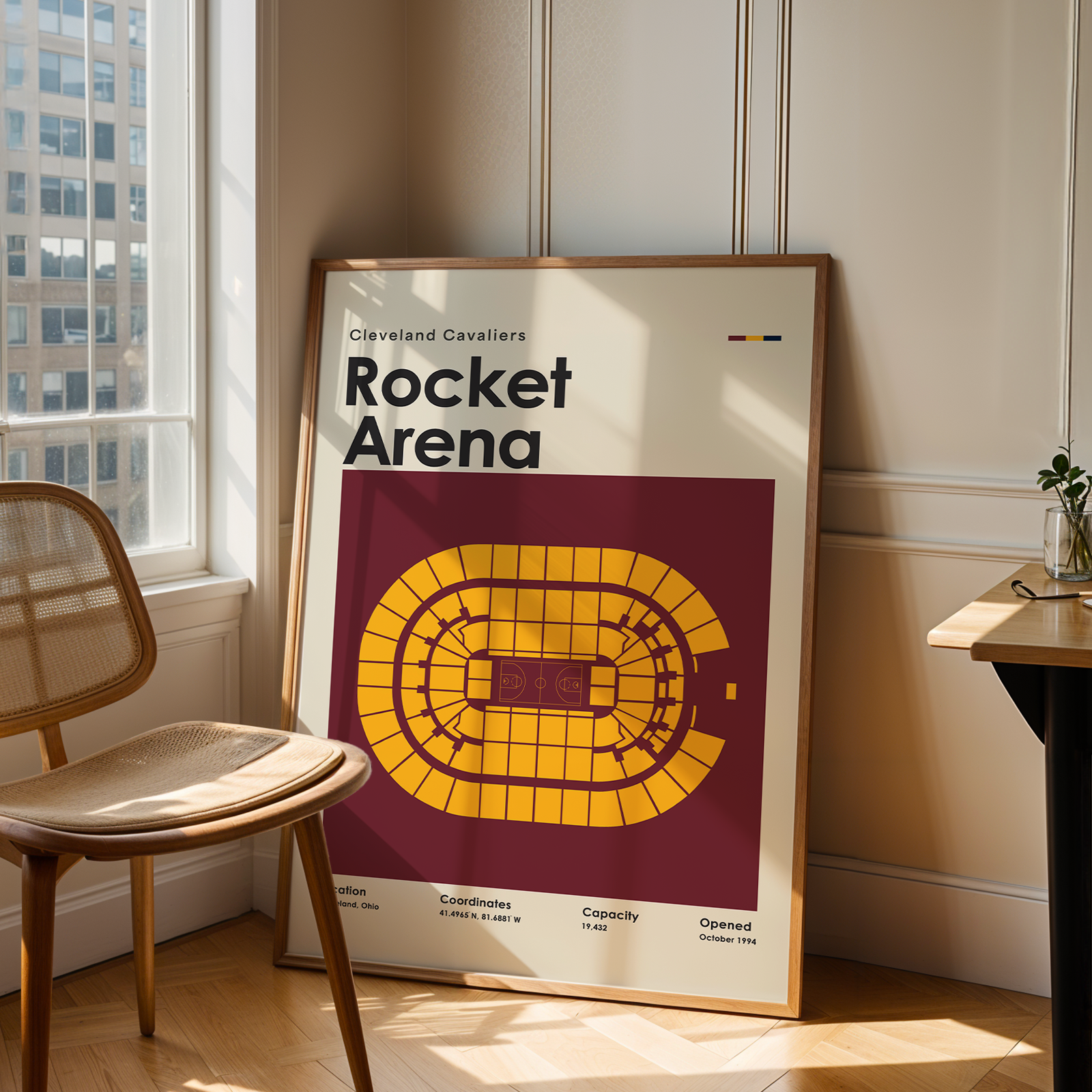 Framed poster of Rocket Arena with a chair and table in a room.