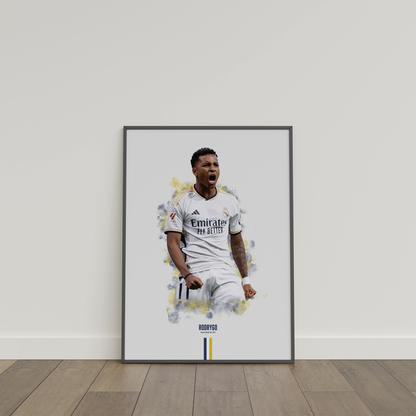 framed poster mockup of soccer player rodrygo leaning on a white wall