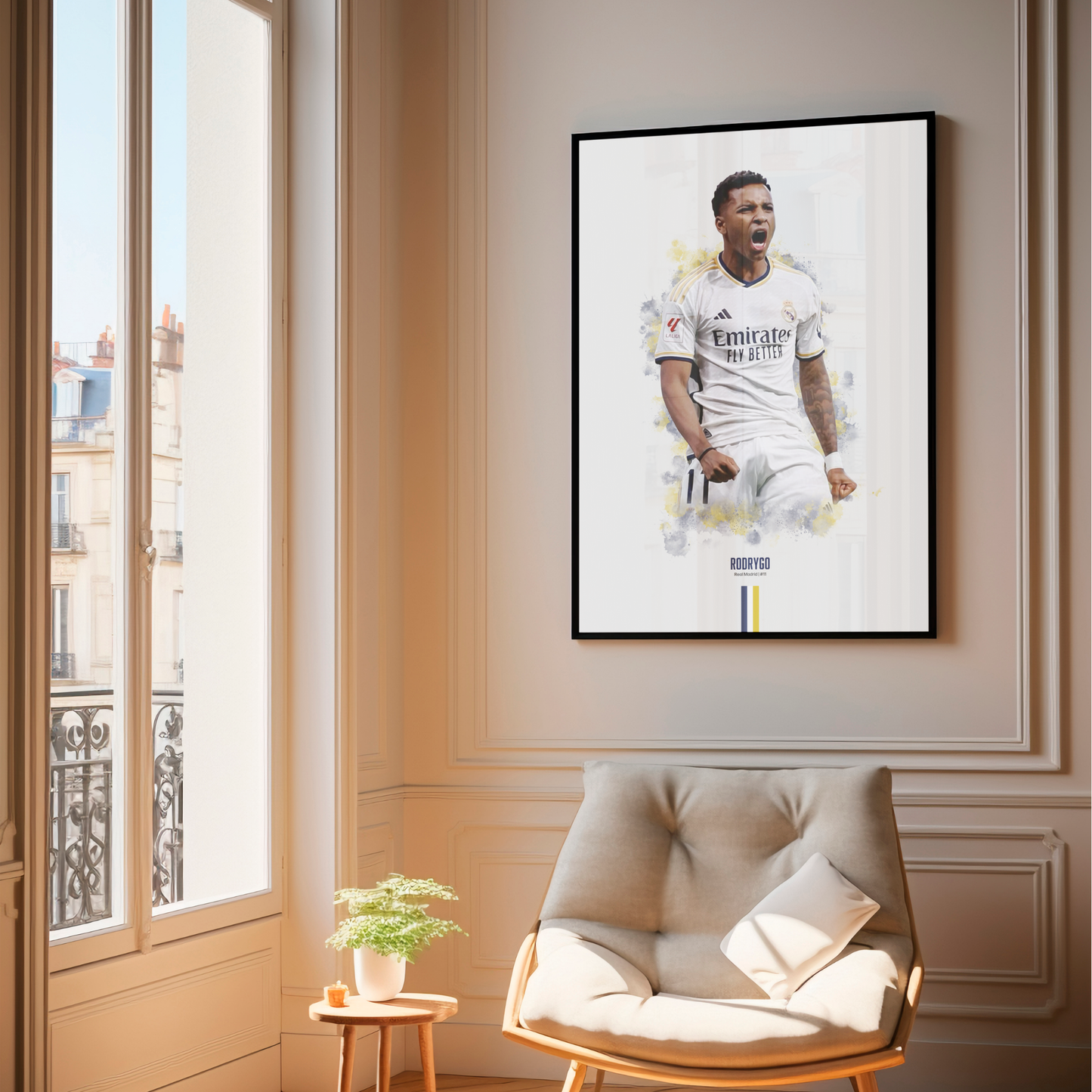 framed poster mockup of soccer player rodrygo hanging in a living room