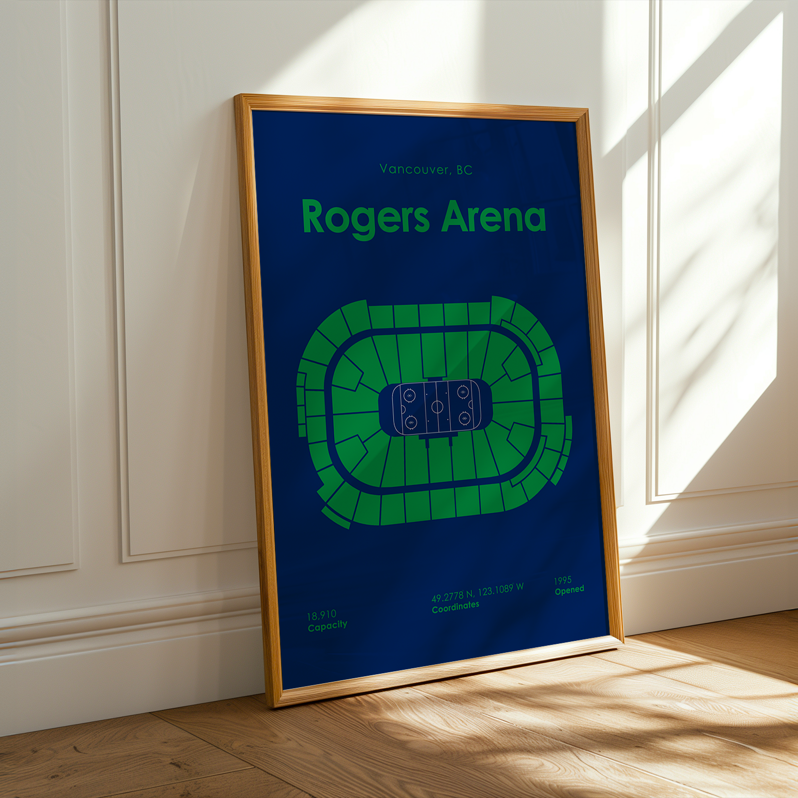 Framed poster of Rogers Arena on a wall with sunlight casting shadows.