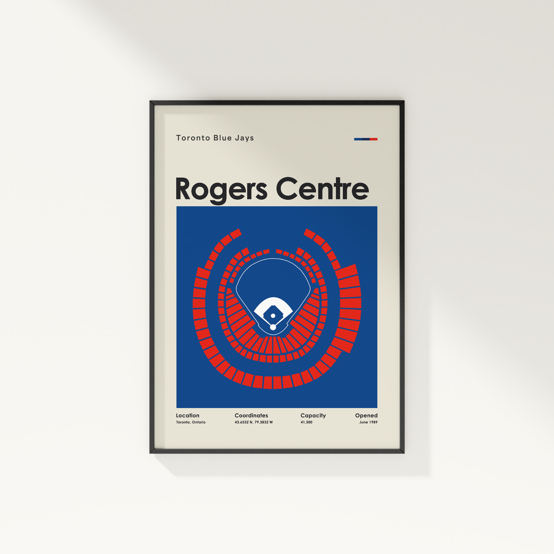 Framed poster of Rogers Centre with Toronto Blue Jays logo on a white wall