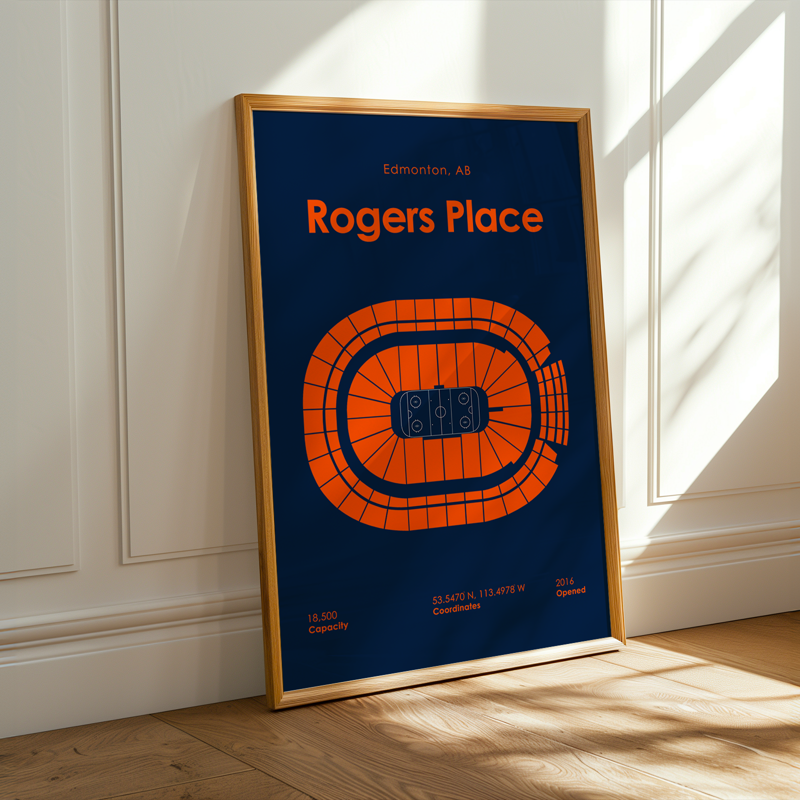 Framed poster of Rogers Place arena layout on a wall.