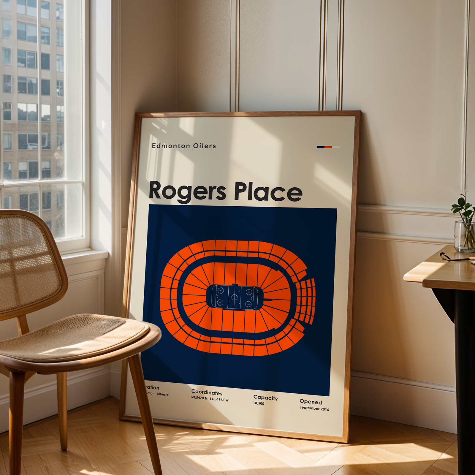 Poster of Rogers Place in a room with a chair and table.