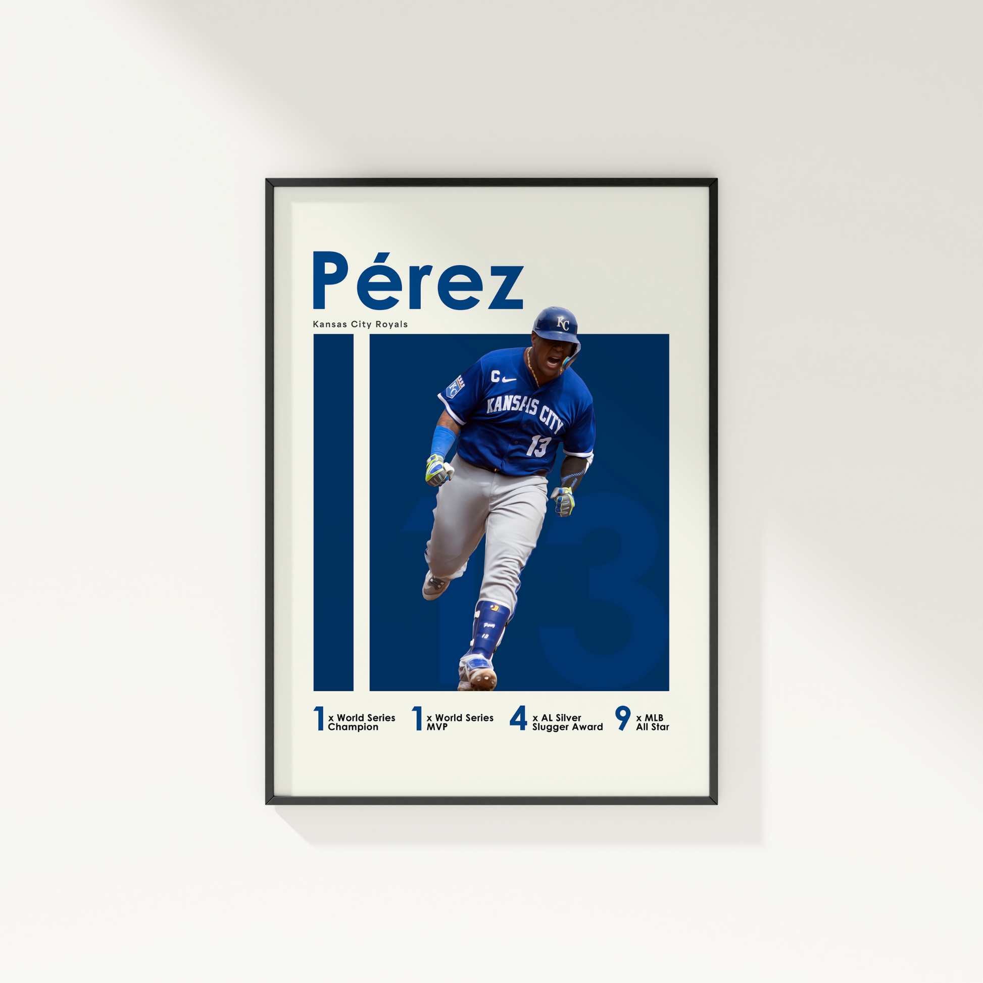 framed poster mockup of baseball player salvador perez hanging on a white wall