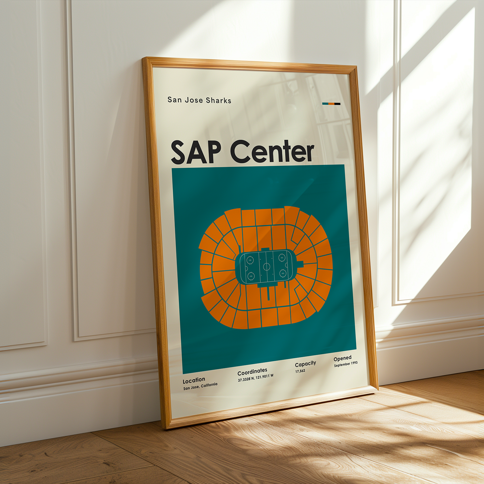 Framed poster of SAP Center at San Jose Sharks on a wall.