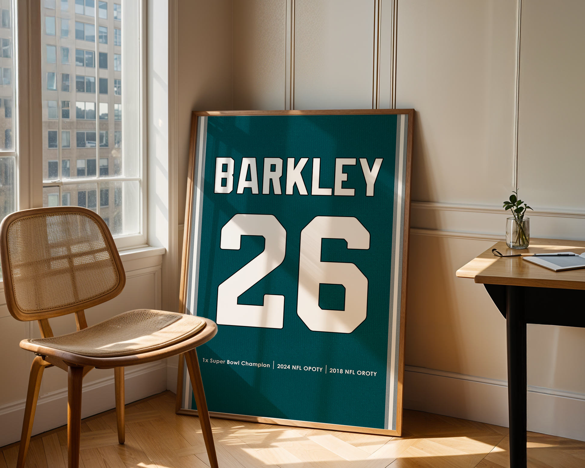 Framed sports jersey with 'Barkley' and number '26' in a room with a window and chair.
