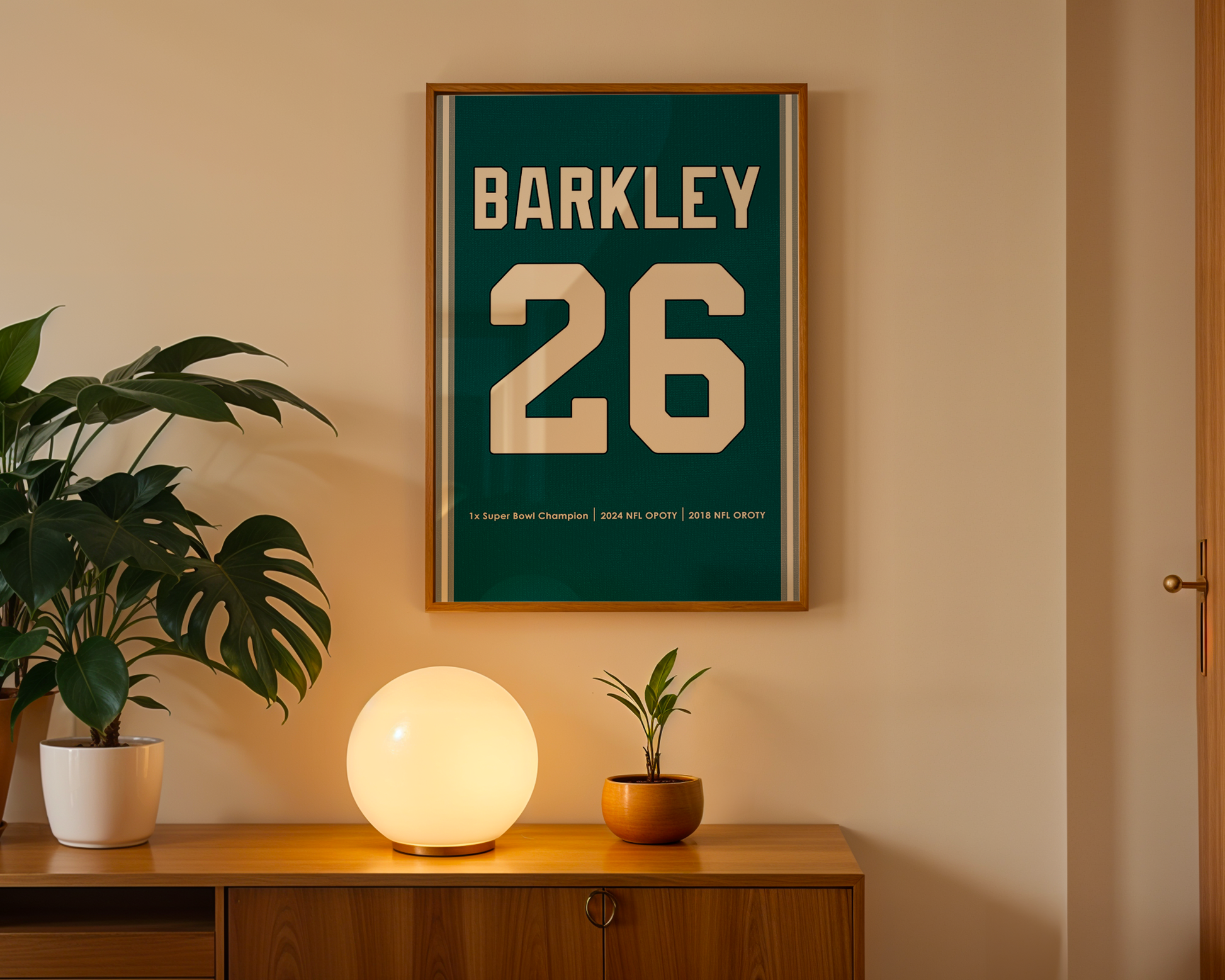 Framed poster with 'Barkley 26' on a wall above a wooden cabinet with decorative items.