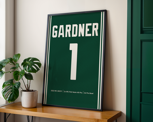 Framed sports jersey with 'Gardner' and number '1' on a wooden shelf.