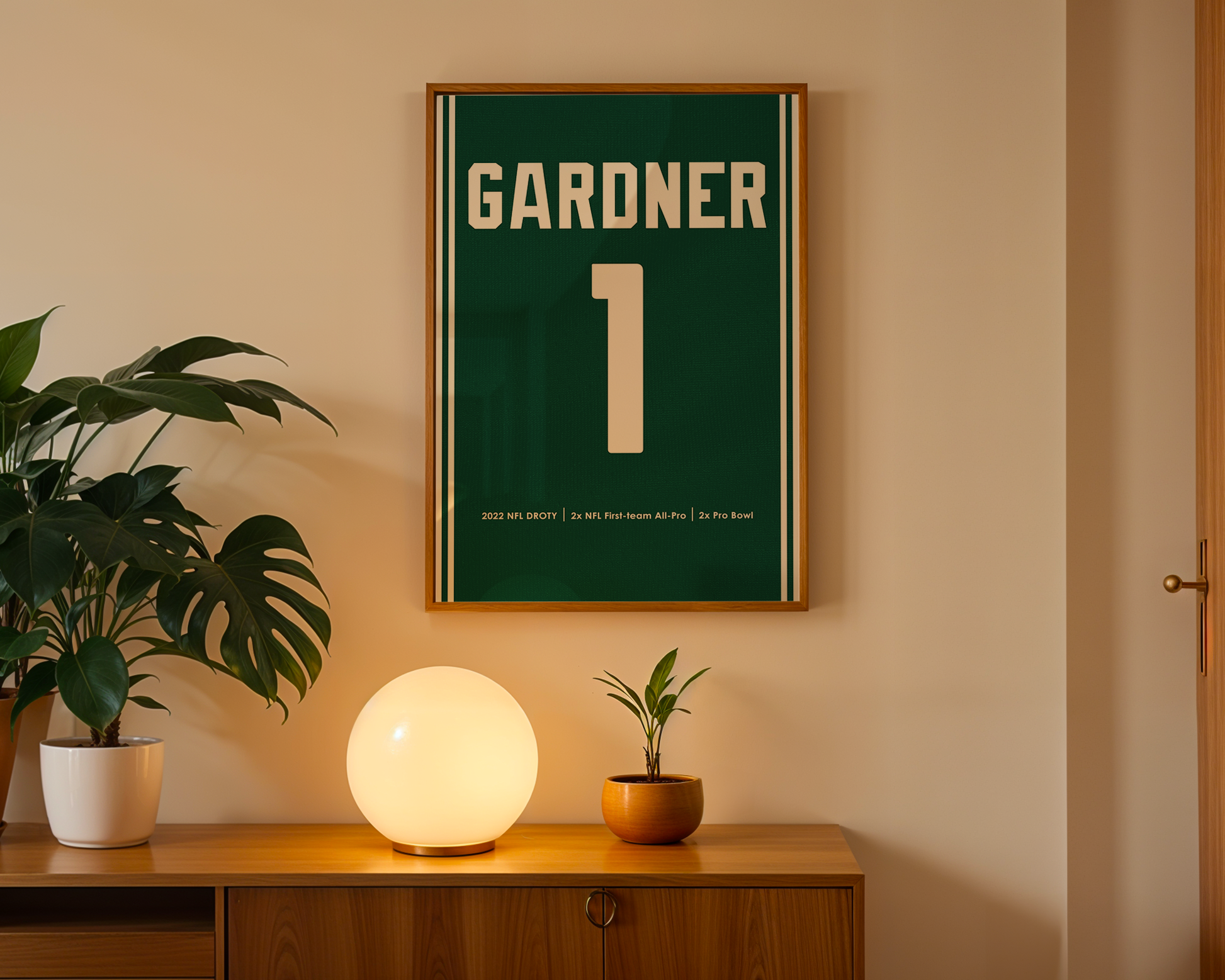 Framed poster with 'Gardner 1' on a wall above a wooden cabinet with decorative items.