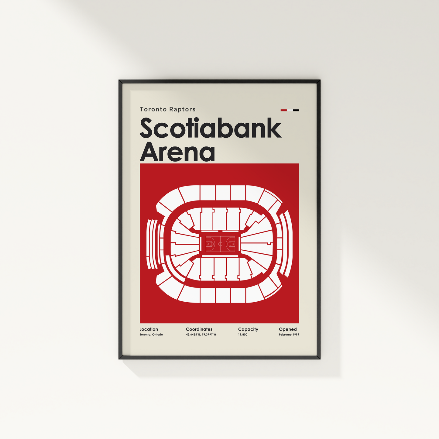 Framed poster of Scotiabank Arena with Toronto Raptors branding on a white wall.