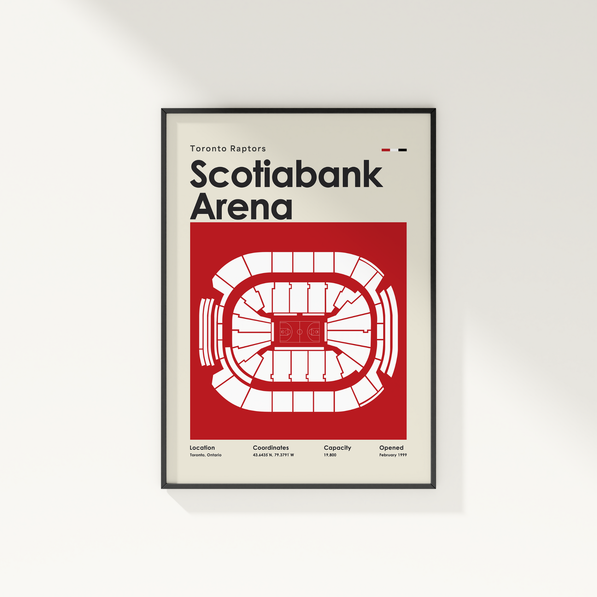 Framed poster of Scotiabank Arena with Toronto Raptors branding on a white wall.
