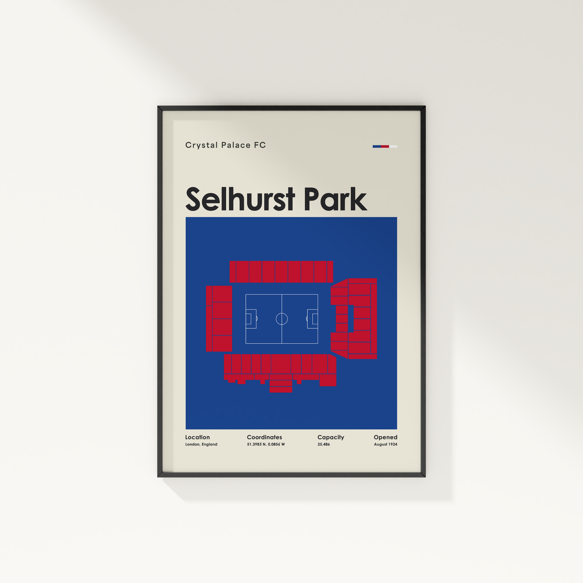 Framed poster of Selhurst Park stadium layout for Crystal Palace FC on a white wall.