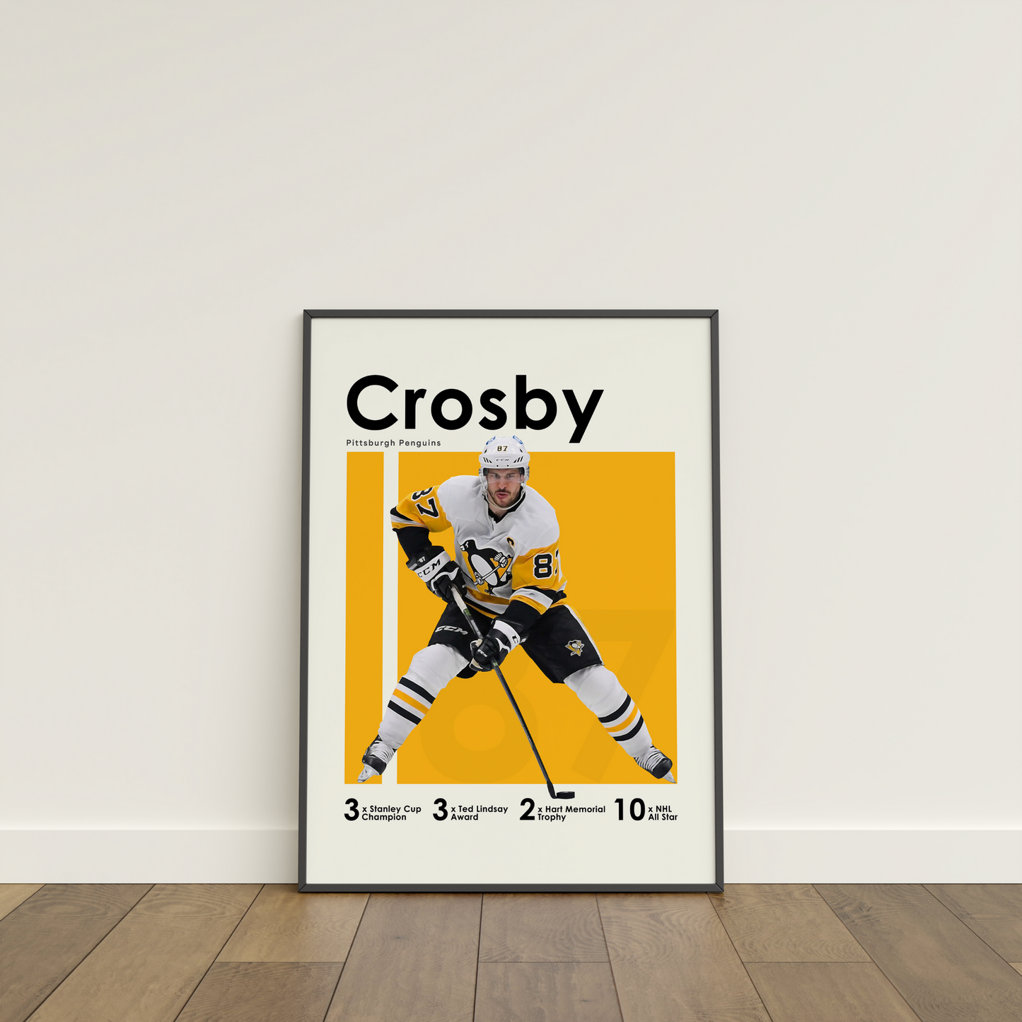 framed poster mockup of hockey player sidney crosby leaning on a white wall