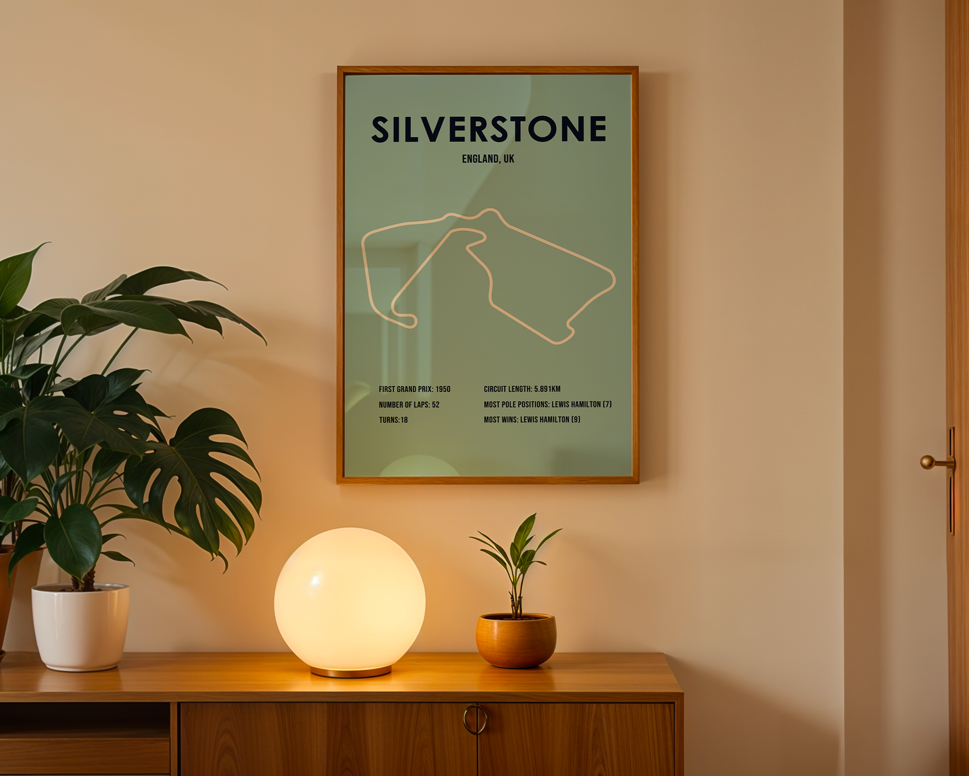 Framed 'Silverstone' poster on a wall above a wooden cabinet with decorative items.