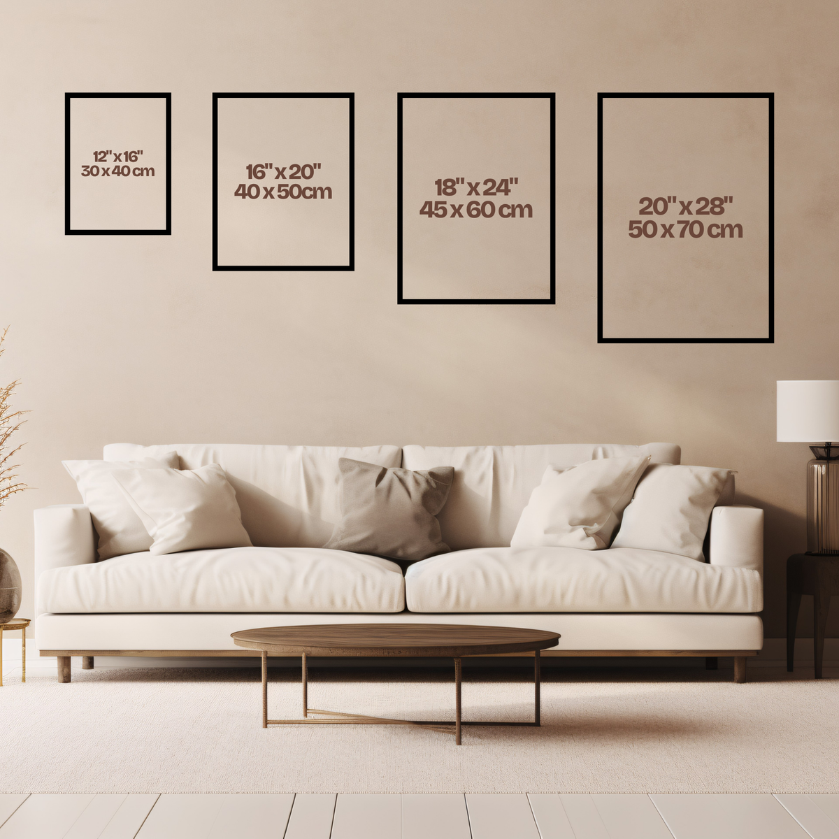Living room with a white sofa and wall art frames displaying sizes.