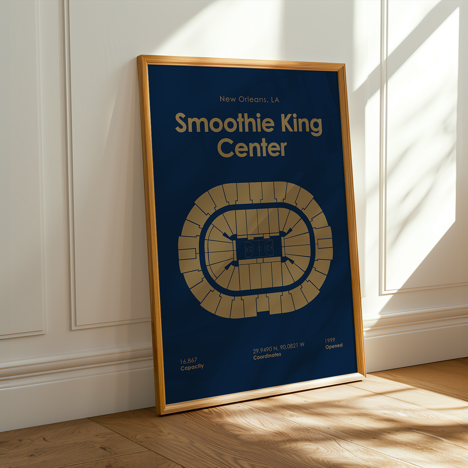 Framed poster of Smoothie King Center on a wall with sunlight casting shadows.
