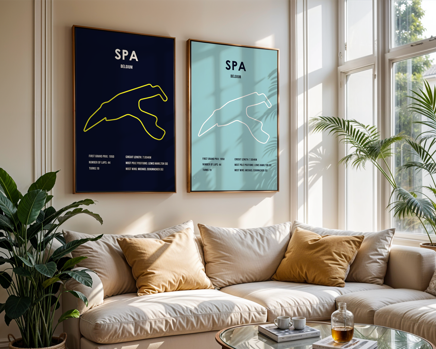 Living room with a beige sofa, decorative pillows, and two framed posters on the wall.