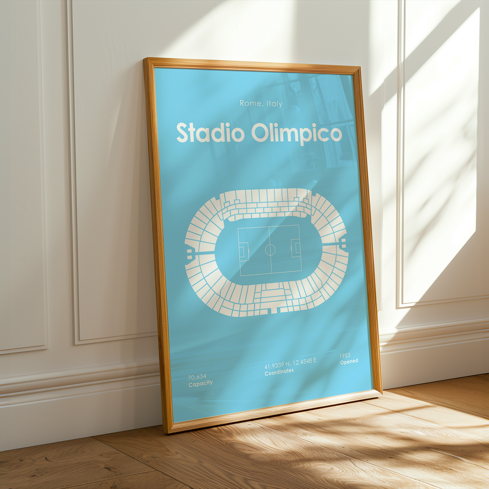Framed poster of Stadio Olimpico on a wall with sunlight casting shadows.
