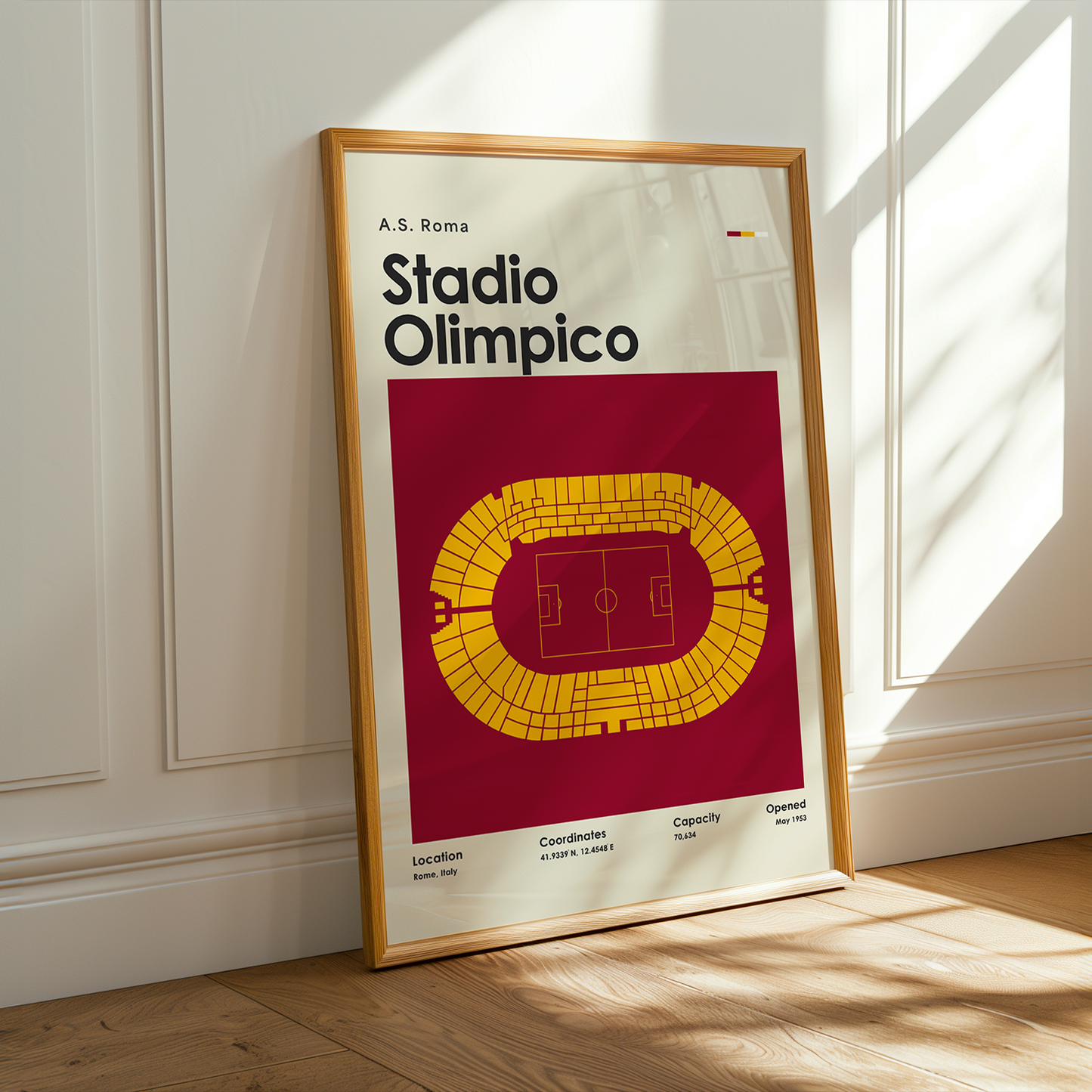 Framed poster of A.S. Roma Stadio Olimpico on a wall with sunlight casting shadows.