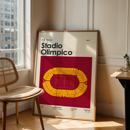 Framed poster of Stadio Olimpico in a room with a chair and table.