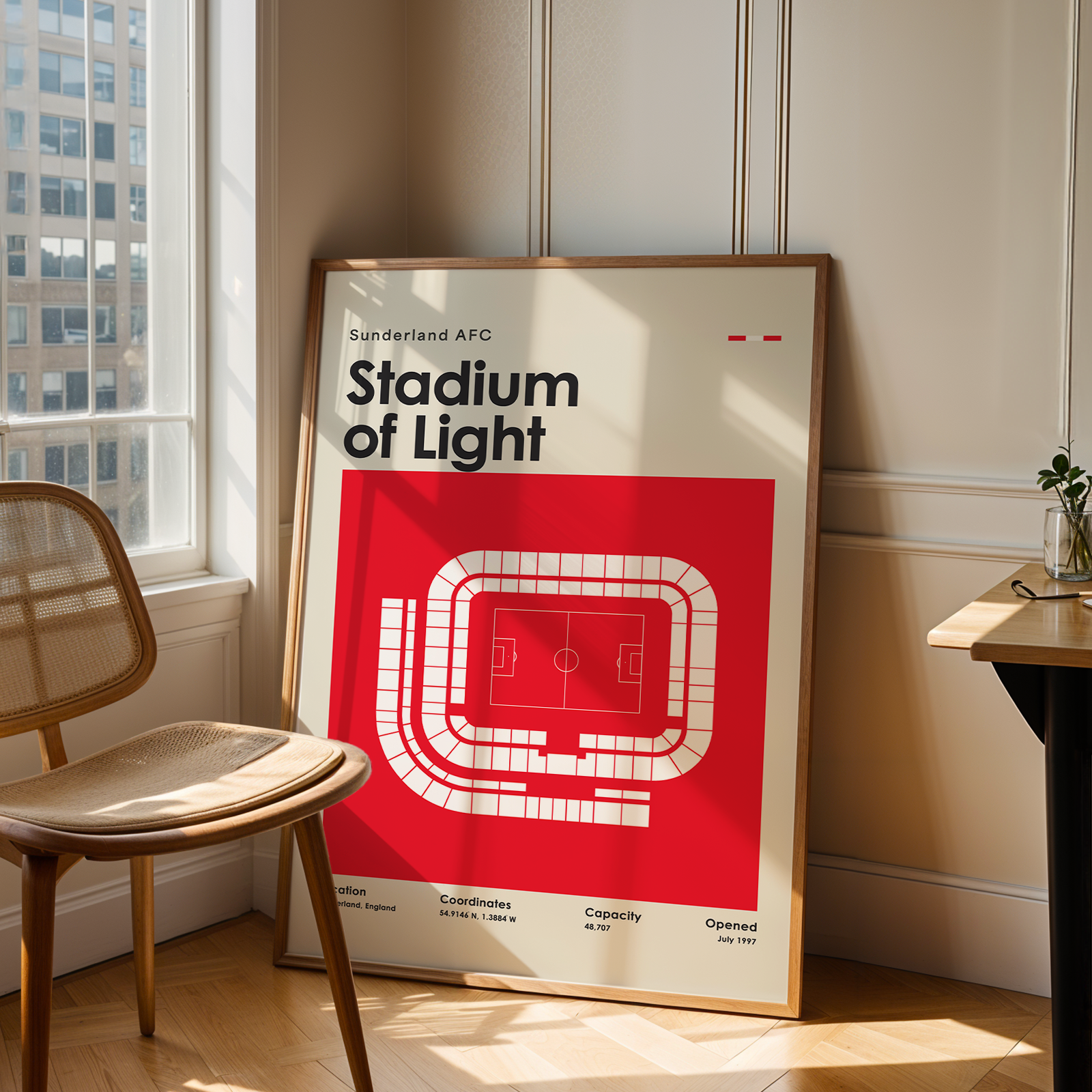 Poster of Sunderland AFC Stadium of Light in a room with a chair and table.